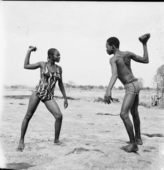 photograph of man and woman combat