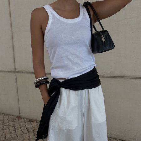 Woman wearing a tank top and balloon pants