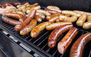 Sausages and hot dogs, on a grill