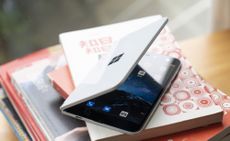 Microsoft's Surface Duo on top of a pile of books
