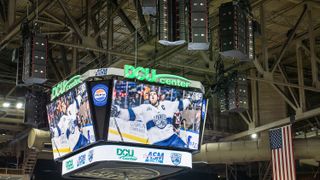 A new sound system and massive centerhang display hang from the rafters at the DCU Center.