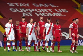 Players line up against a free kick during the Premier League match at Anfield, Liverpool. Picture date: Saturday May 8, 2021