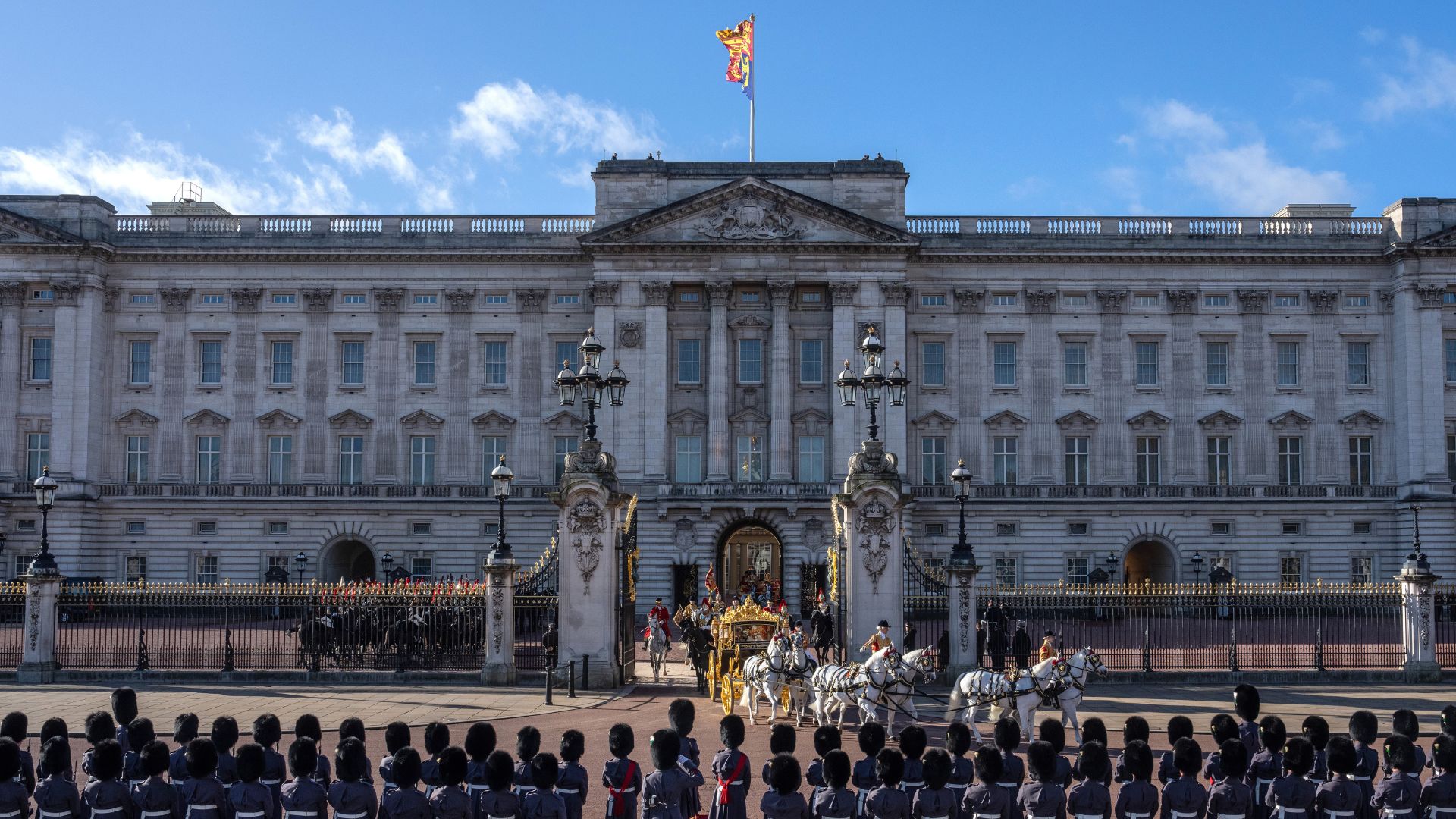 Guards line up outside of Buckingham Palace