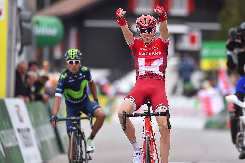 Zakarin celebrates as Quintana sits up at the end of stage 4 at the Tour de Romandie.
