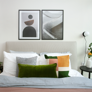 bedroom with white wall and frame on wall