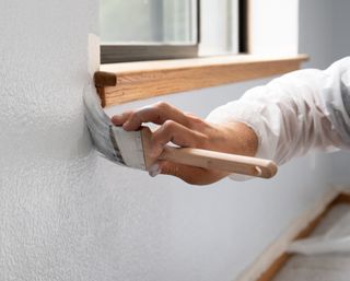 cutting in under a window when painting a wall