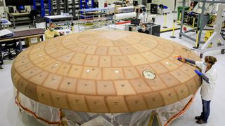 The heat shield for NASA's Orion crew capsule is very large but of a traditional design. 