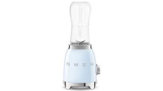 A Smeg Personal Blender in baby blue on a white background