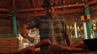 Danny Trejo flips chicken legs.