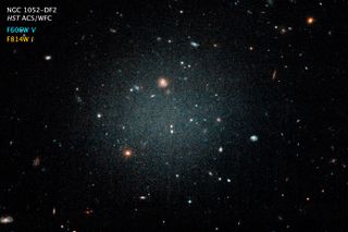 A Hubble Space Telescope image of the galaxy NGC 1052-DF2. Distant galaxies are visible through DF2 due to its lack of stars.