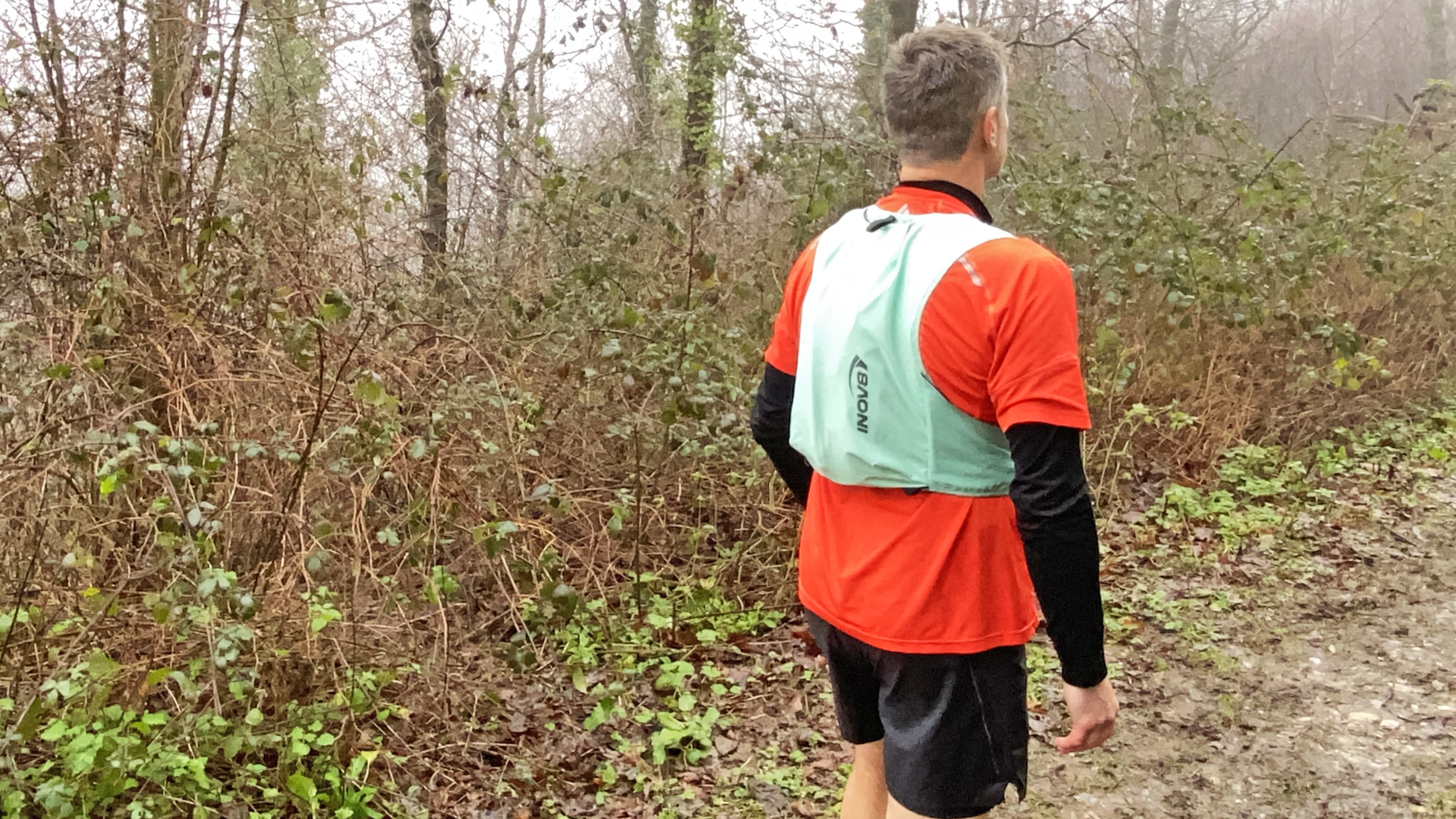 Runner wearing the inov8 Racepac 8 seen from rear