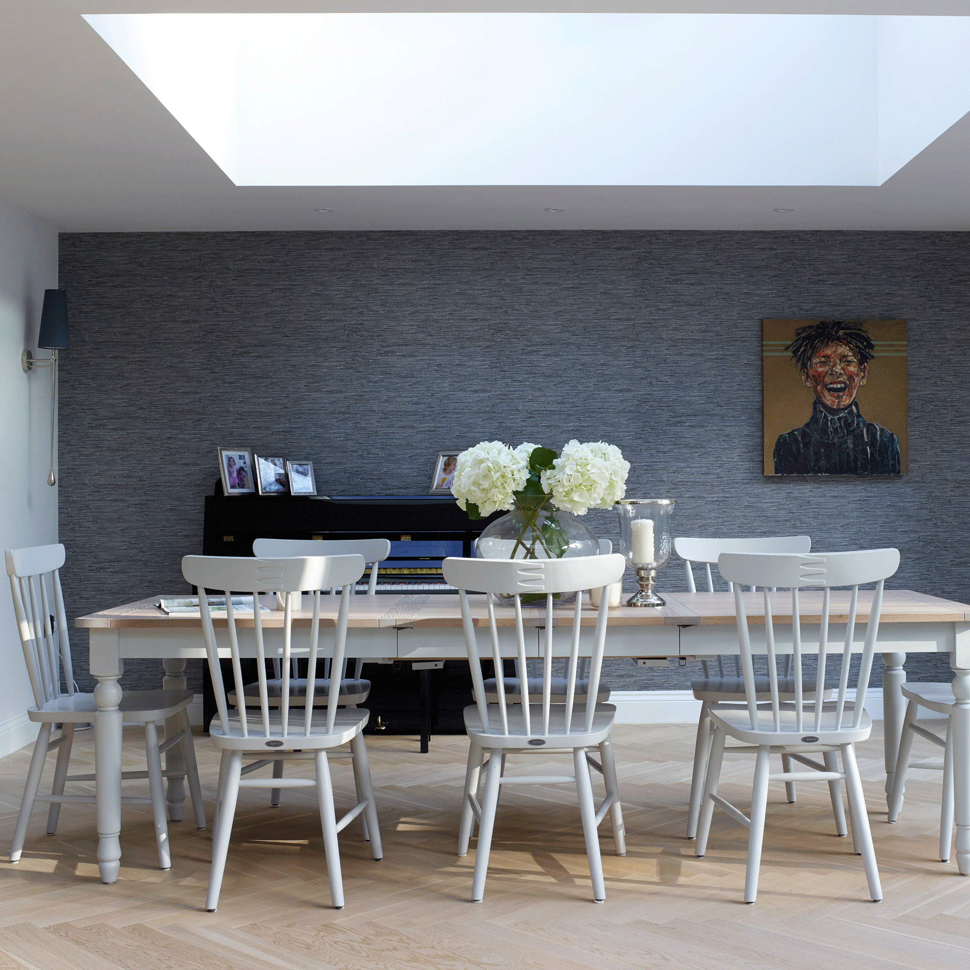 Grey dining room with yellow portrait