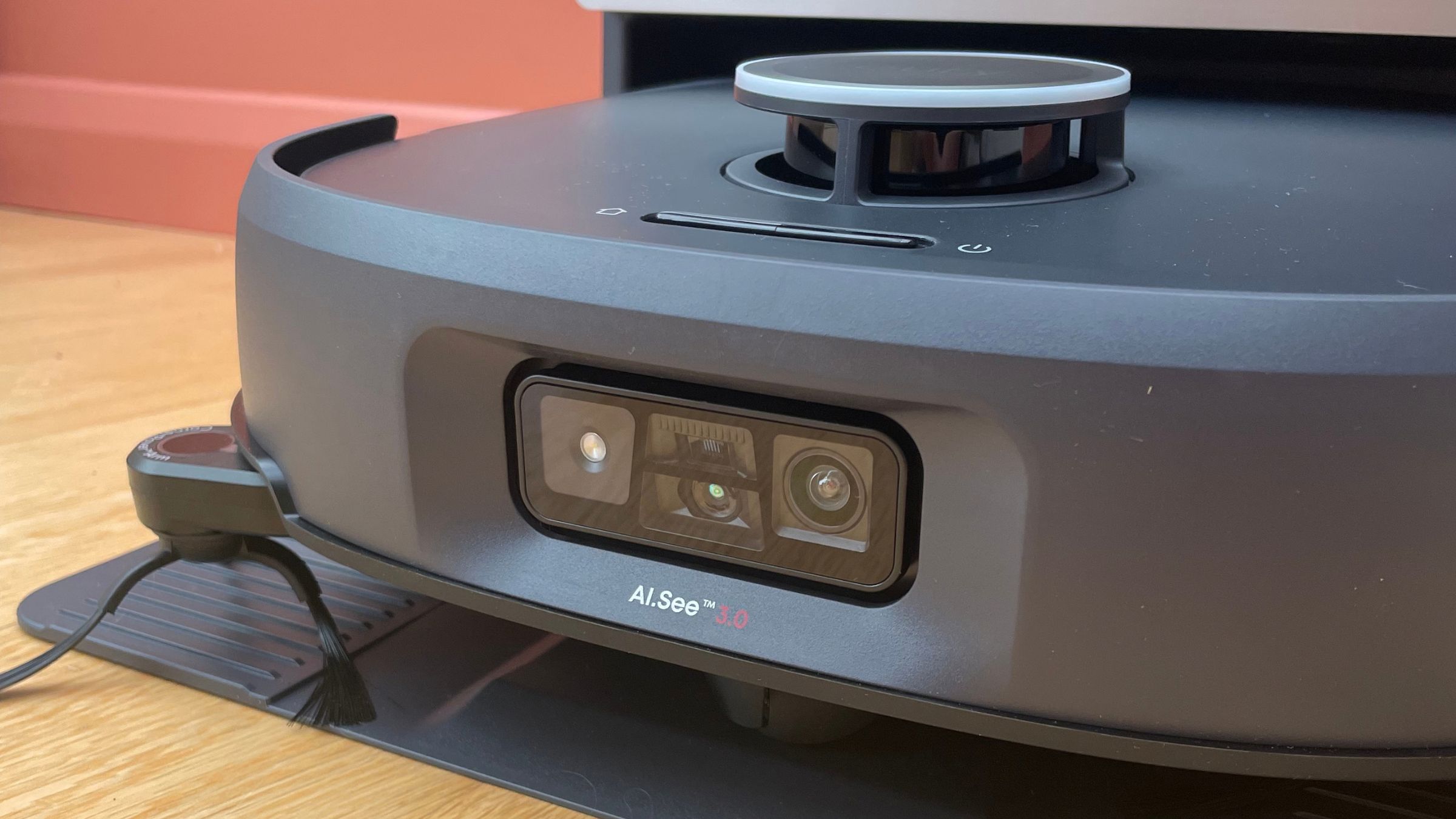 Close up of the robot sitting on the dock of the Anker eufy Robot Vacuum E35 Omni
