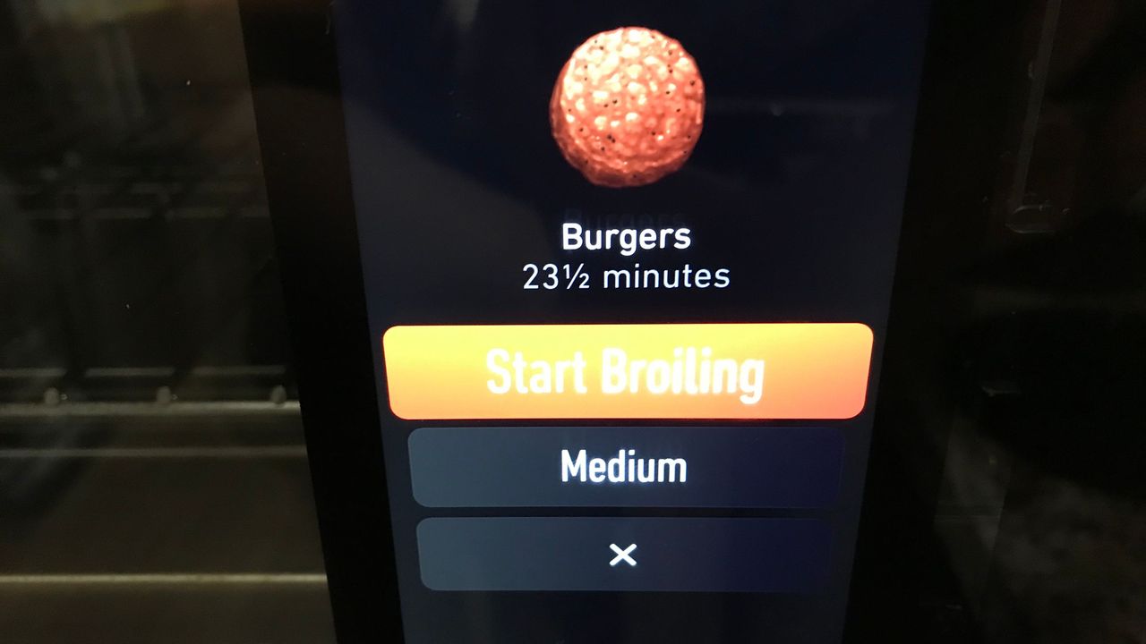 June Oven cooking a hamburger