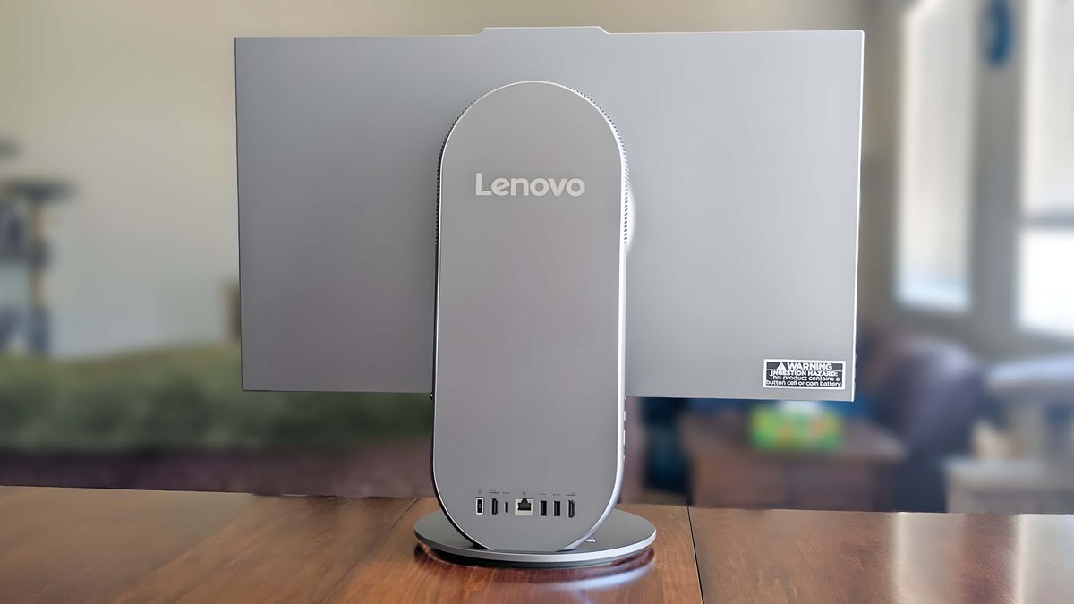 Lenovo Yoga AIO 27" sitting on a table and facing away so that the back side is visible.