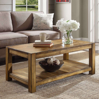 A wooden coffee table in a living room.