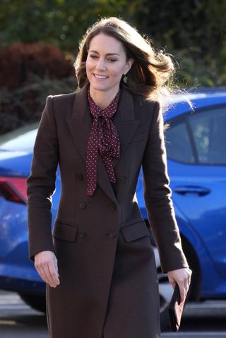 Kate Middleton used the belt from a polka dress as a bow scarf during a surprise visit to Southport in October