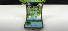 A still image of a primtive foldable iPhone design, taking a picture of a plant