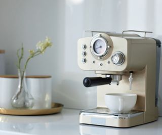 cream espresso machine on a white countertop