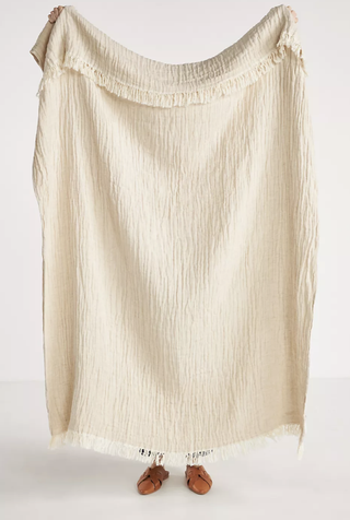 Linen-cotton blend throw blanket in neutral color from Anthropologie.