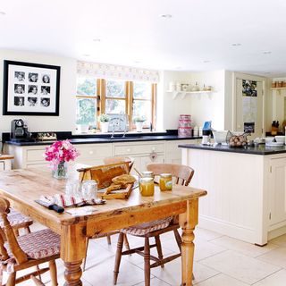 idyllic sussex farmhouse kitchen with limestone flooring splashback tiles and kitchen units