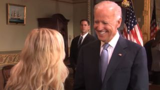 Joe Biden smiling at Leslie on Parks and Recreation.