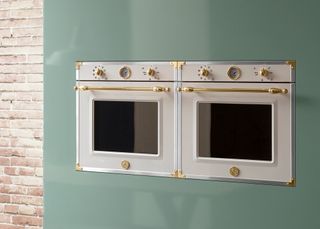 a white and gold tower oven from bertazzoni