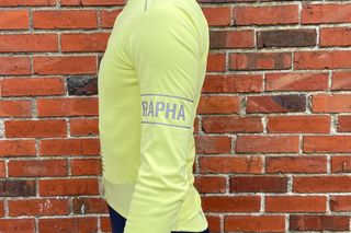 Image shows a rider wearing Rapha Men's Pro Team Long Sleeve Gore-Tex Infinium Jersey
