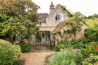 Glass house in gravel garden