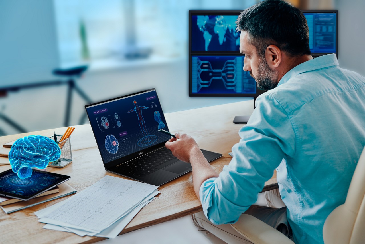 Man working at desk on laptop