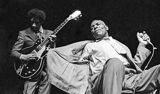 Hubert Sumlin (left) and Howlin' Wolf perform onstage