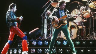  singer Freddie Mercury and bassist John Deacon of British rock band Queen in concert, 1980