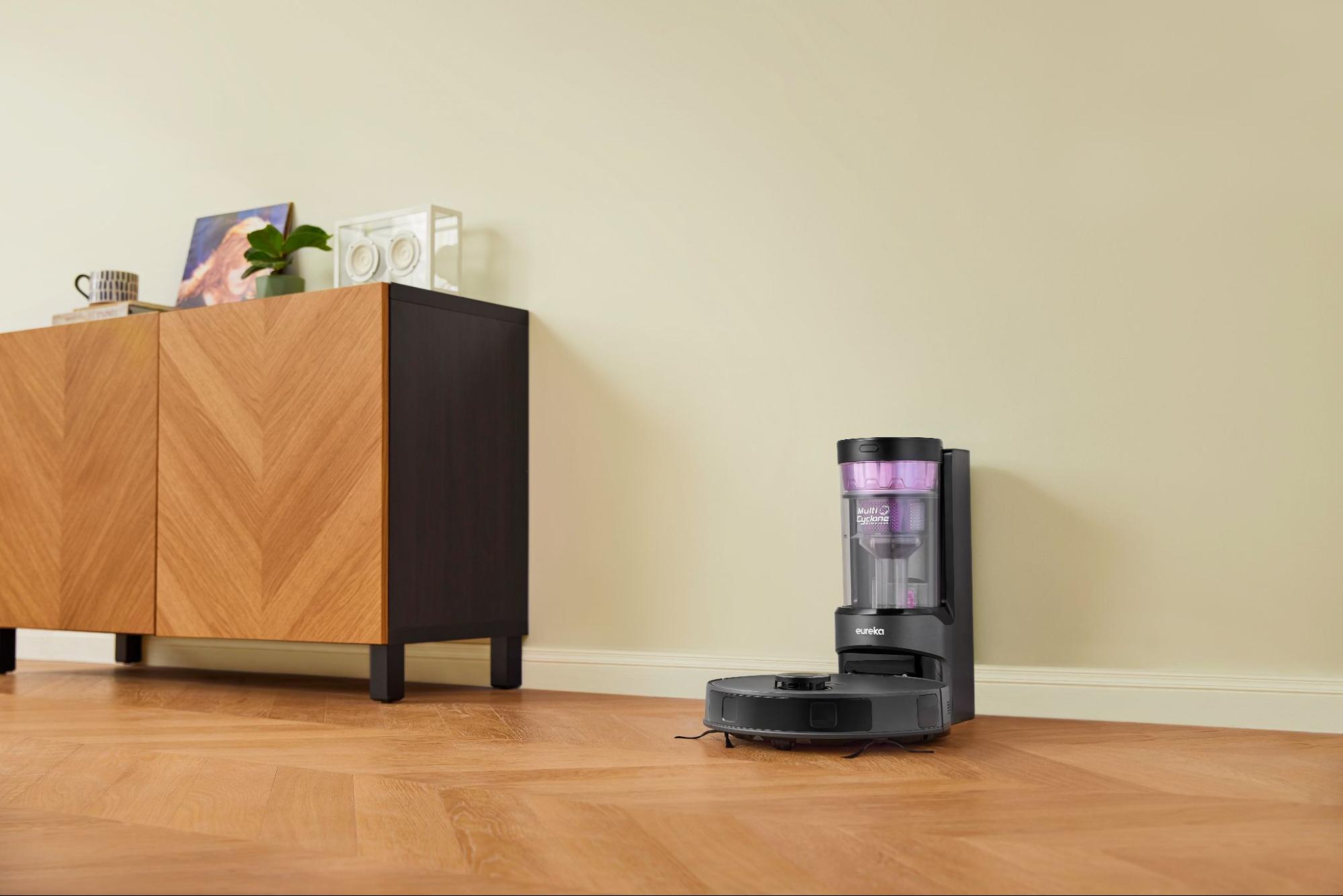 Eureka E20 Plus robot vacuum cleaner in action and docked.