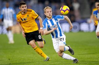 Alex Pritchard (right) and Ruben Neves battle for the ball