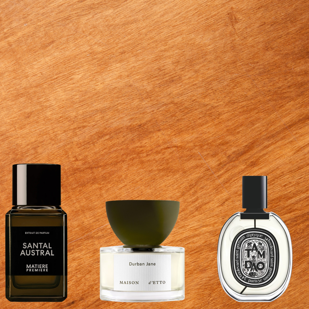 Three sandalwood fragrances in front of a wood. background