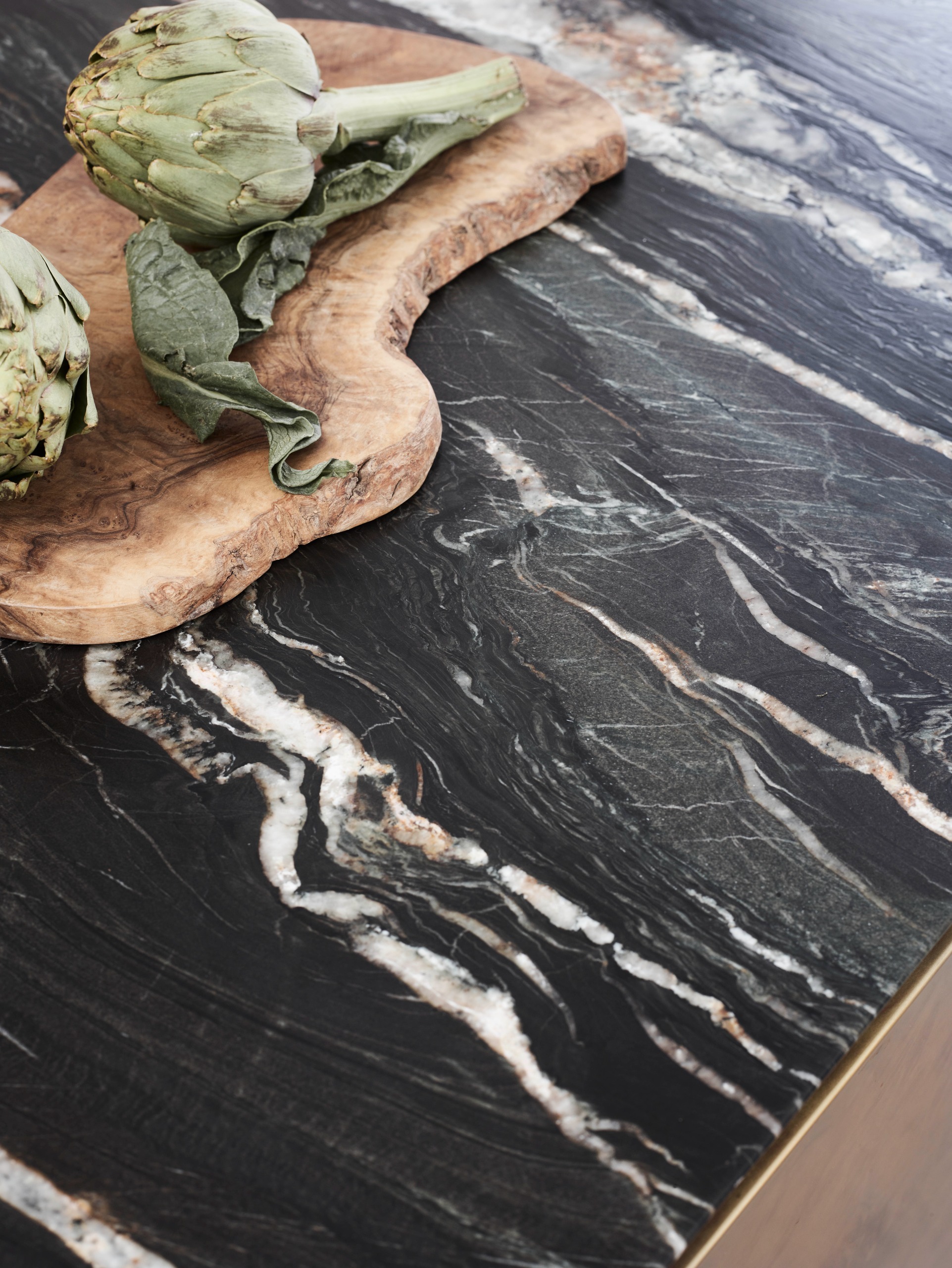 a close up of a black antiqued granite