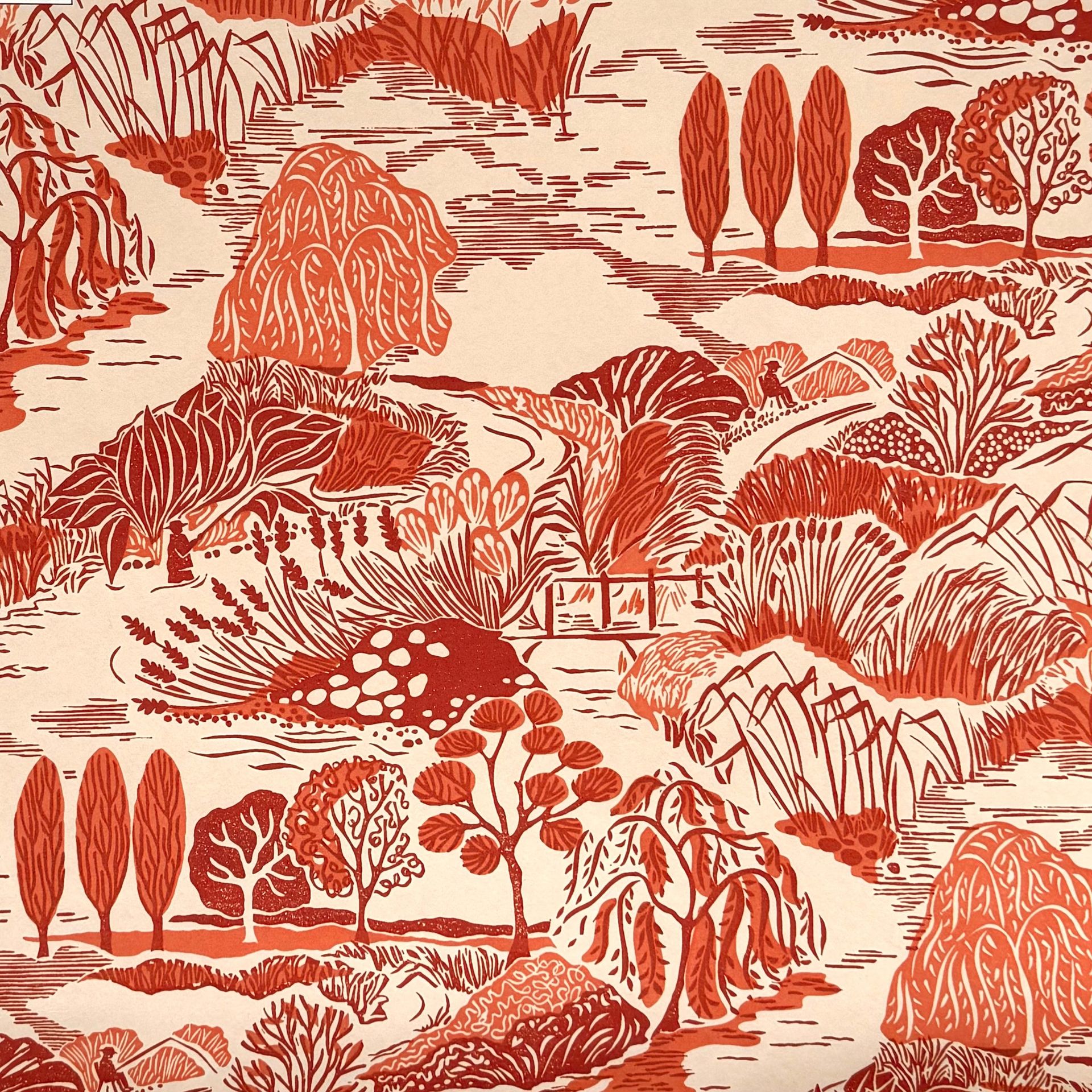 A cream, orange and red wallpaper featuring abstract trees and grasses