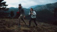 best outdoor watch: two hiker climbing a mountain wearing the Polar Grit X2 Pro outdoor watch