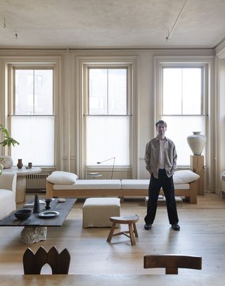 colin king standing in his minimalist living room