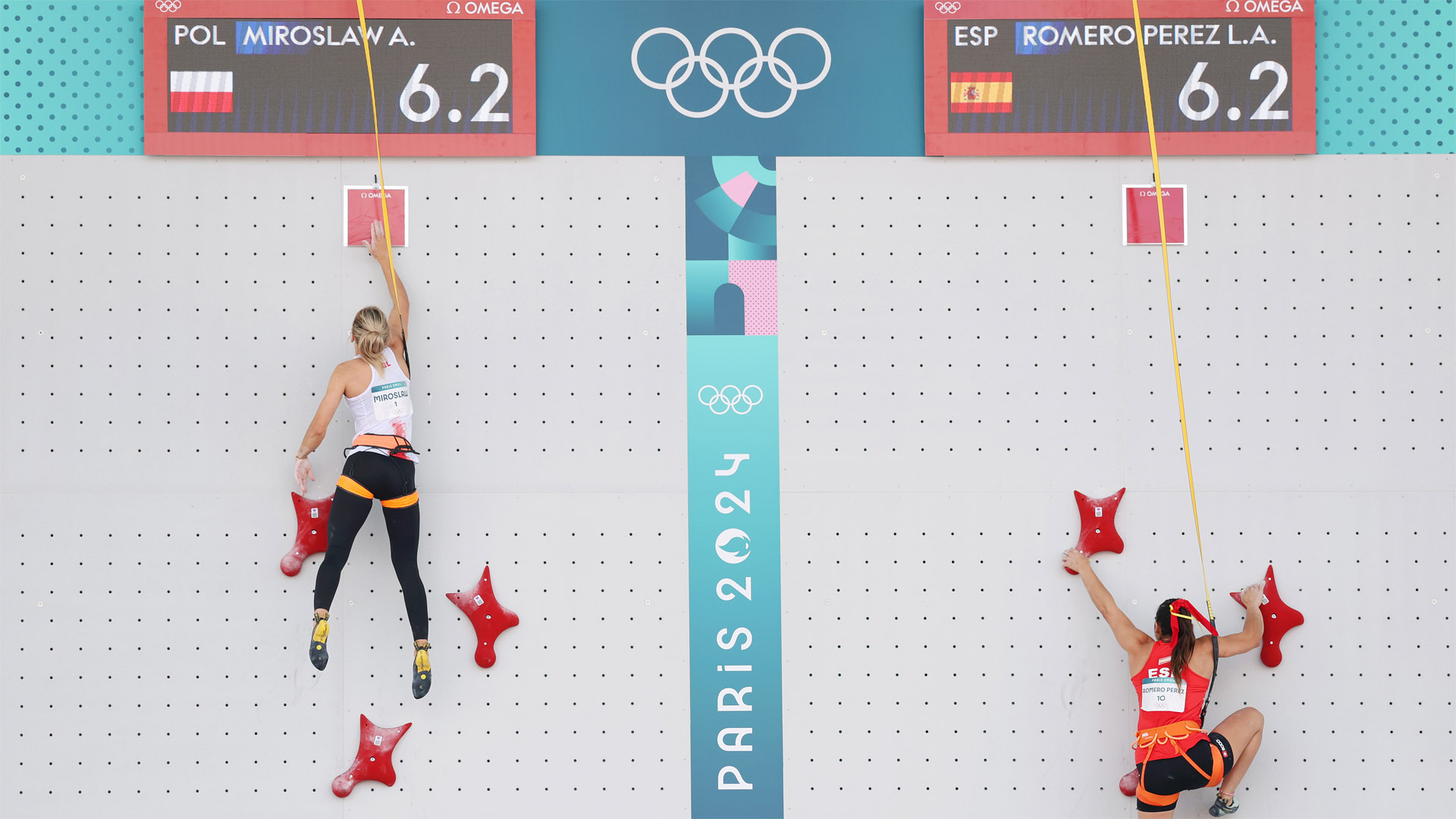 Eventual gold medalist Aleksandra Miroslaw beats Spain's Leslie Adriana Romero Perez in the speed climbing quarter-final