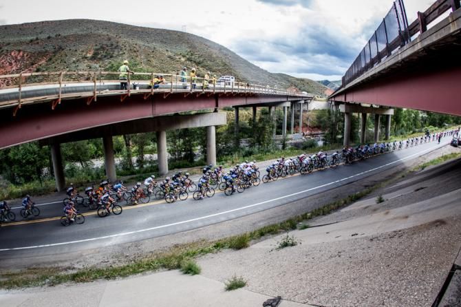 The peloton passes the highway on the way towards Beaver Creek.