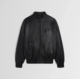 a Phoebe Philo leather jacket in front of a plain backdrop