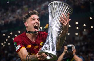 Nicolo Zaniolo of AS Roma celebrates with the UEFA Europa Conference League Trophy after their sides victory during the UEFA Conference League final match between AS Roma and Feyenoord at Arena Kombetare on May 25, 2022 in Tirana, Albania.