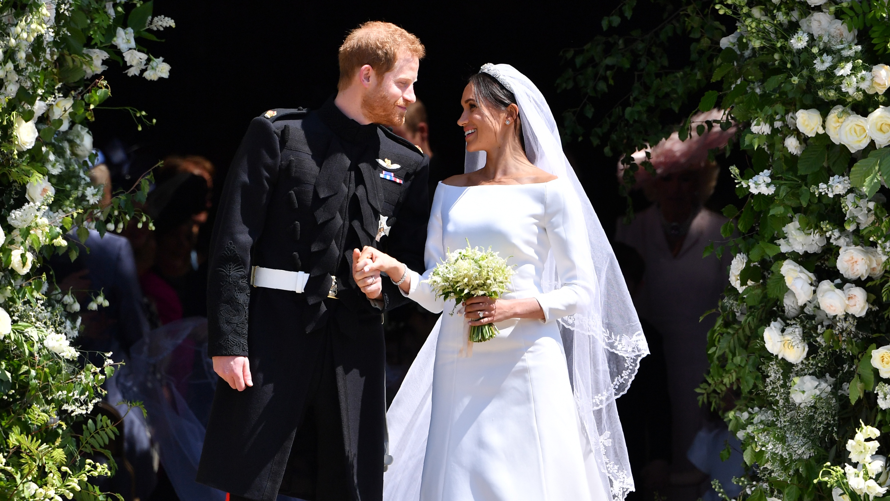 Prince Harry and Meghan, Duchess of Sussex leave from the West Door of St George's Chapel, Windsor Castle, in Windsor on May 19, 2018
