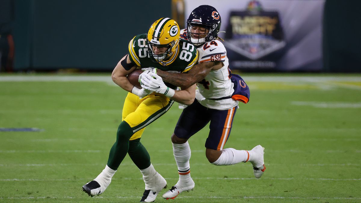 Robert Tonyan #85 of the Green Bay Packers runs with the ball while being tackled by Buster Skrine #24 of the Chicago Bears in the first quarter at Lambeau Field on Nov. 29, 2020 in Green Bay, Wisconsin.