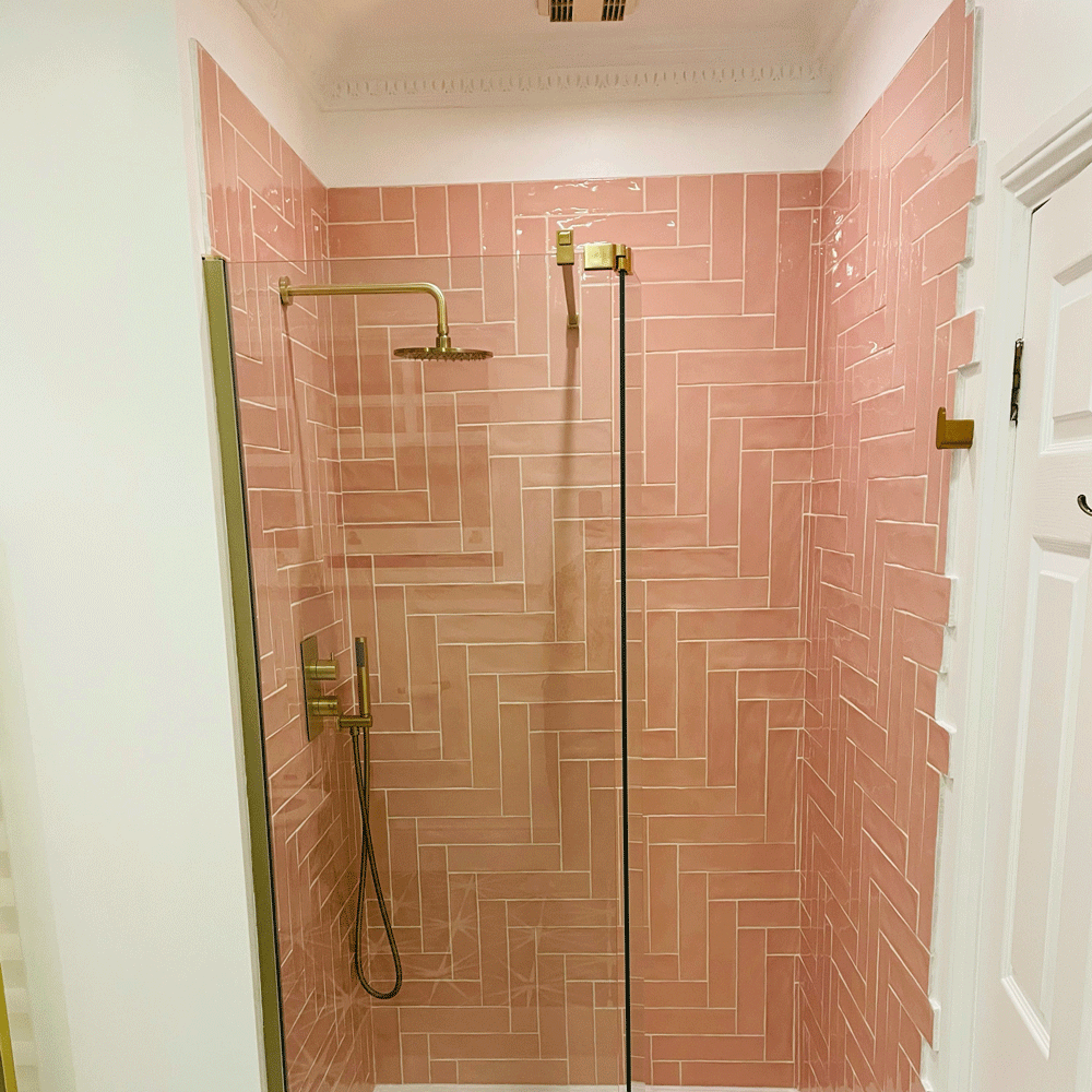 bathroom with shower pink tiles and glass shower screen