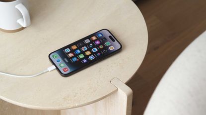 an iphone 14 on charge