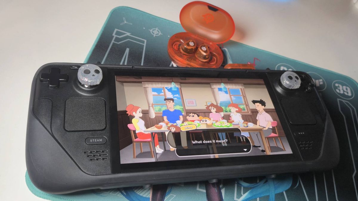 Photo of the SteelSeries Arctis Game Bud 2.4GHz dongle hooked up to the Steam Deck OLED handheld.