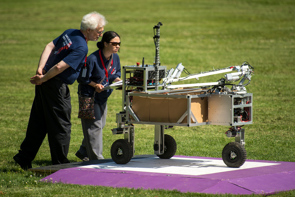 NASA 2013 Sample Return Robot Challenge organizers monitor the Wunderkammer team robot during level one of the challenge at Institute Park, Wednesday, June 5, 2013 at the Worcester Polytechnic Institute (WPI) in Worcester, Mass. The annual contest awards 