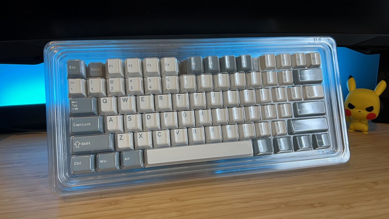 Ghost Judge keycap set on wooden desk with blue backlighting